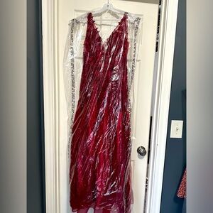 Burgundy Bellas prom dress, size xs never worn and it has been altered